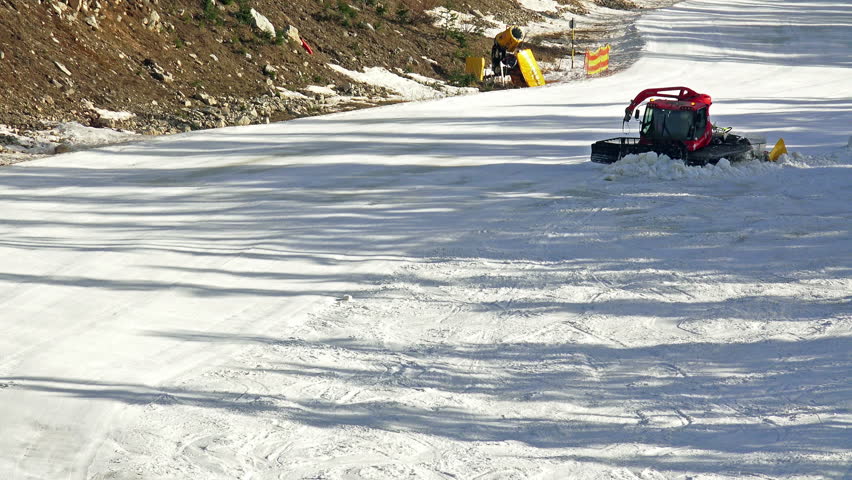 Snowcat preparing a slope at skiing resort