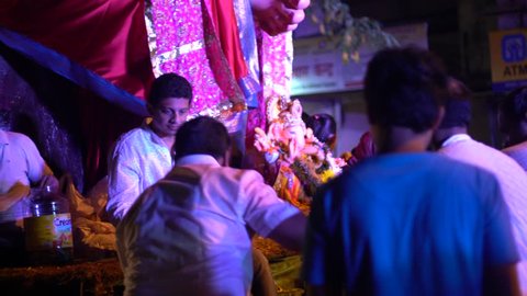 A crowd gathered in front of a huge idol of lord Ganesh, celebrating the last day of the auspicious Ganesh Chaturthi festival in Kandivali, Mumbai, Maharashtra, India on 5th September 2017.