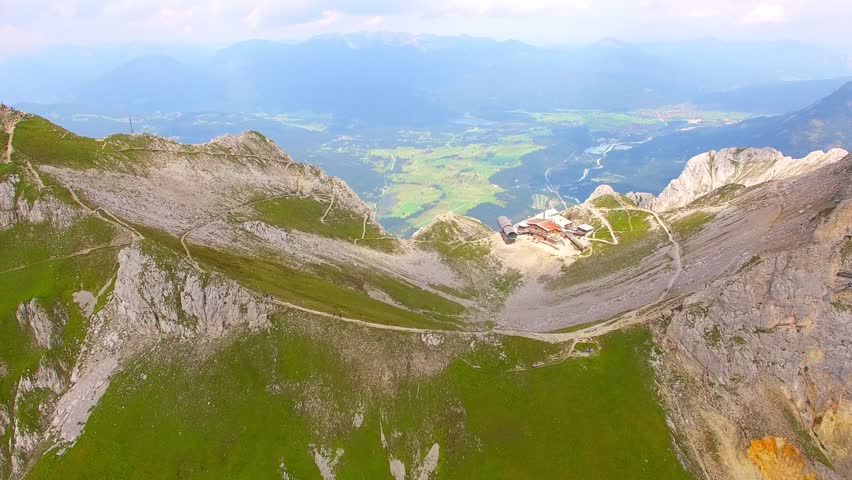 Camera flight over alpine landscape on Germany and Austria border. Westliche Karwendelspitze is a 2385 m above sea level high mountain in the Karwendel on the border between Bavaria and North Tyrol. 