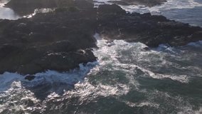 Aerial view of the beautiful rocky coast on Pacific Ocean during a summer morning. Video taken in Ucluelet, Vancouver Island, British Columbia, Canada.