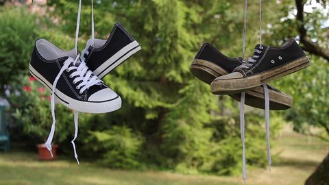 Old Sneakers Next New Sneakers Hung Stock Footage Video (100% Royalty ...