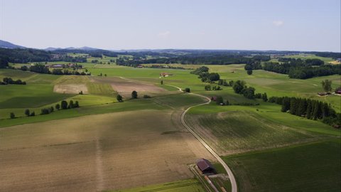 Wide aerial shot of fields in rolling landscape / Thundorf, Germany