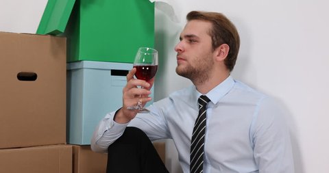 Attractive Business Man Drinking Cup of Wine Celebrate New Home Property Move