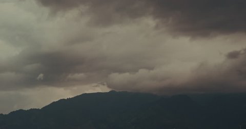 Thunder clouds over the mountain in Costa Rica, Time Lapse. Red scarlet.