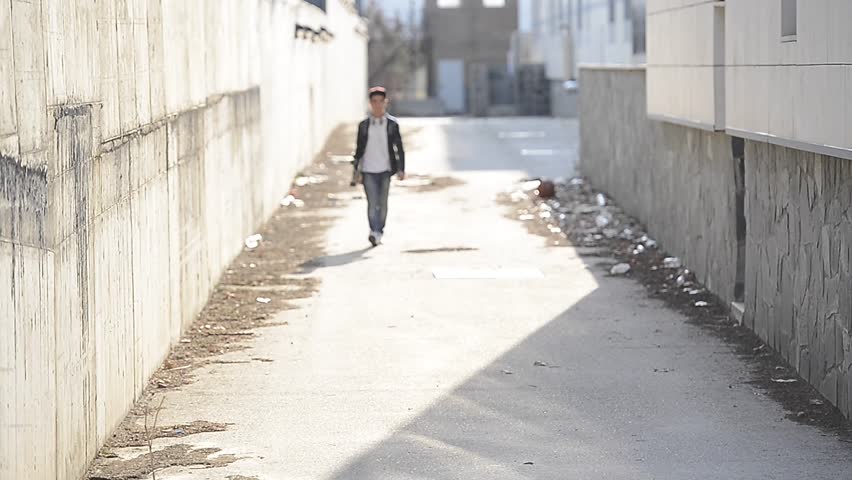Young man with backpack and skateboard