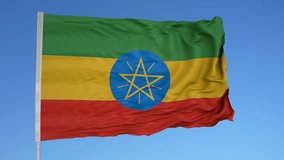 Looping flag for Ethiopia on flag pole, blowing beautifully in the wind. Includes alpha matte.