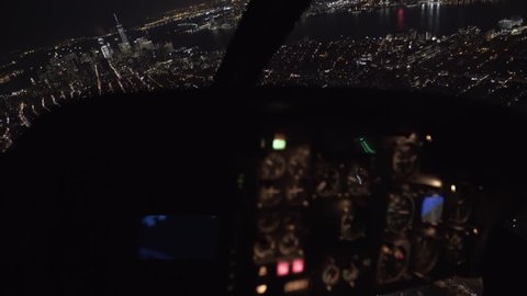 View from cockpit of helicopter flying over New York city