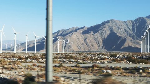 Tracking slow motion shot of San Gorgonio Pass Wind turbine Farm