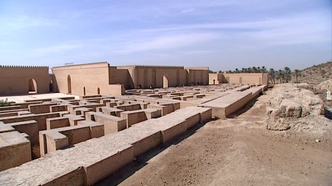 HILLAH, IRAQ - CIRCA 2002: Pan-left across courtyards, crenelated walls, and original fortifications of ancient Babylon. Since 2003 Gulf War occupying forces caused irreparable damage to the site.