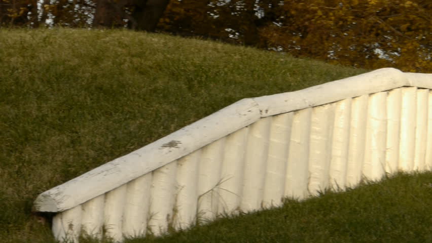 Panning shot of parapet and embrasure with howitzer gun in historic Civil War site of fort Ward in Alexandria Virginia 