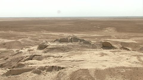 WARKA, IRAQ - CIRCA 2002: WIDE SHOT from the top of the White Temple ruins (originally built atop Anu Ziggurat) as part of the Anu district of Uruk. Stone Temple remains in the background.