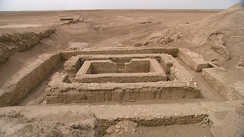 WARKA, IRAQ - CIRCA 2002: White shot of Stone Temple remains. Part of the Anu district of, the ancient city of Uruk, dedicated to the Sumerian sky god Anu. Uruk was one of the first cities in history.