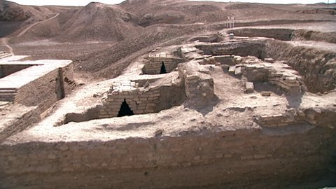 TELL EL MUQAYYAR, IRAQ - CIRCA 2002: Archaeological site Ur. Pan across the exterior architecture of the Royal Cemetery excavated by Sir Leonard Woolley. Over 2000 burials discovered.