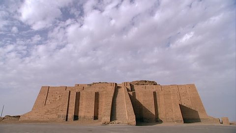TELL EL-MUQAYYAR, IRAQ - CIRCA 2002: Archaeologist walking towards the Great Ziggurat of Ur. Built in the Early Bronze age by King Ur-Nammu as part of a temple complex dedicated to moon god Nanna.