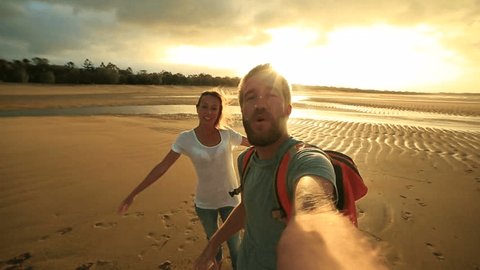 Students in Australia take selfie portrait
Young couple on the beach at sunset take a selfie portrait