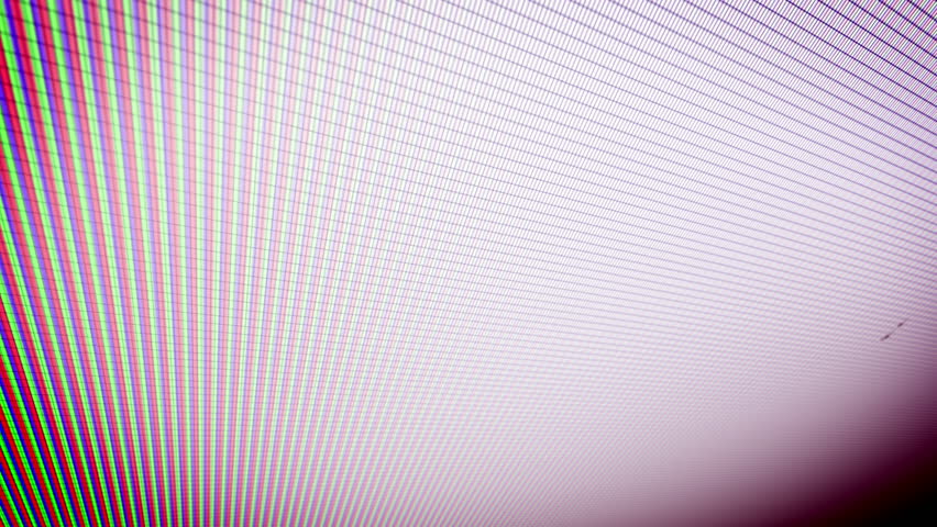 Closeup of the coding information process on a PC screen shown askew with swiftly rushing multicolored dots, lines, digits, letters, equations, placed in a white and violet background