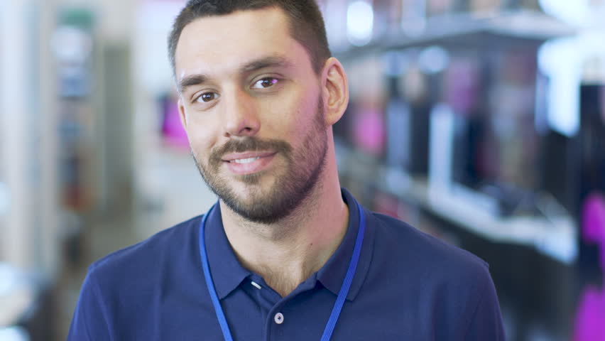 Portrait of a Professional Consultant Smiling and Giving Thumbs Up in the Bright, Modern Electronics Store. A depth of Field Shot. Shot on RED EPIC-W 8K Helium Cinema Camera. Royalty-Free Stock Footage #30542230