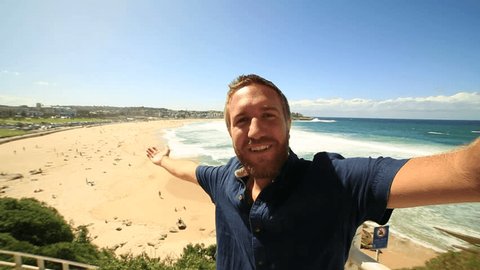 Young man takes a selfie portrait at Bondi beach, Australia
Young tourist taking a selfie at Sydney's most famous beach 