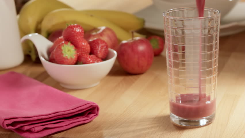 Pouring fruit smoothie