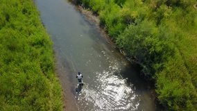 Aerial view of fly fisherman fishing in Montana river