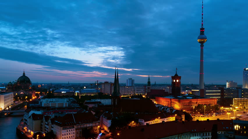 Berlin, Germany. Illuminated landmarks in Berlin, Germany in the morning. Time-lapse of colorful cloudy sky at sunrise