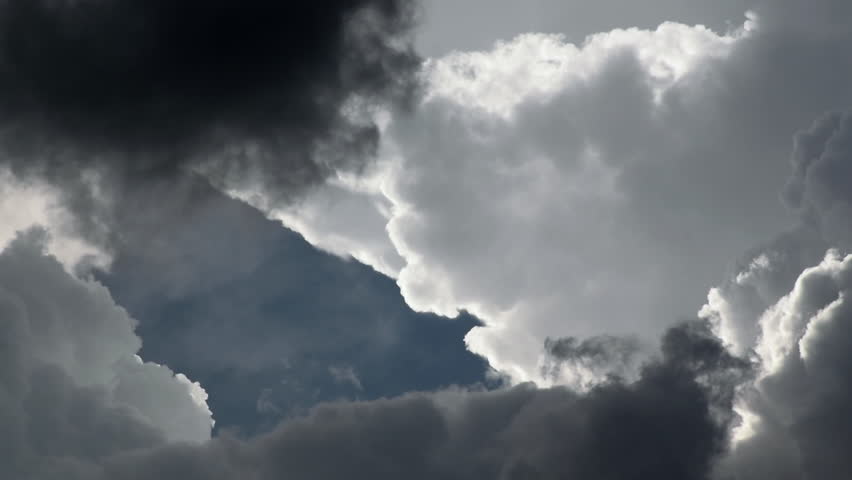 Dramatic clouds before storm, zoomed in flight-like movement