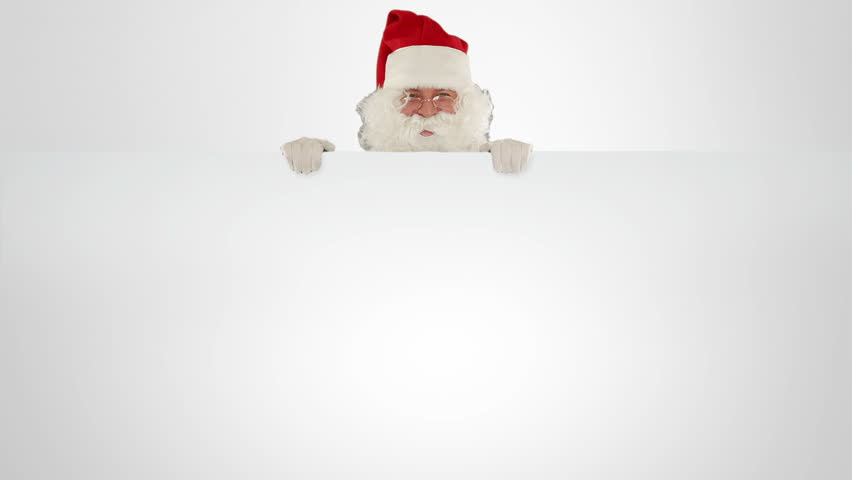 Santa Claus appears behind a white sheet with space for text