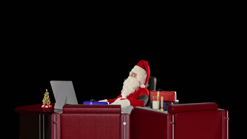 Santa Claus at work checking blood pressure, against black