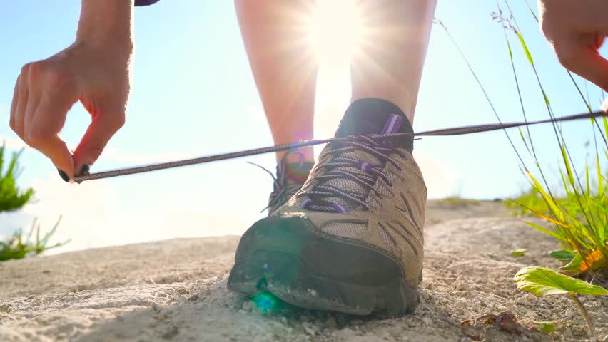 8 in 1 video. Woman is traveling with a backpack over hilly terrain. Hiking