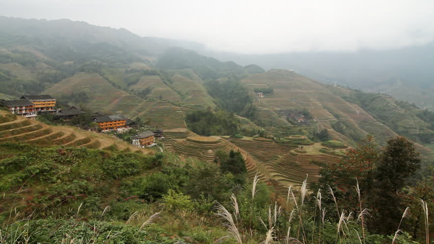 Terraced rice fields and traditional village - Longsheng, Guangxi province,