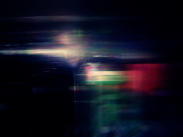 NTSC - Night lights streak as we travel down a city street (Loop).