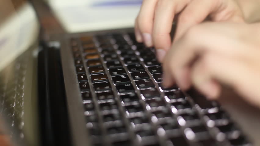 Girl typing on a laptop keyboard (HD)