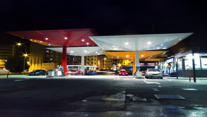 SPAIN - CIRCA 2012: Time lapse of several cars filling fuel at gas station at