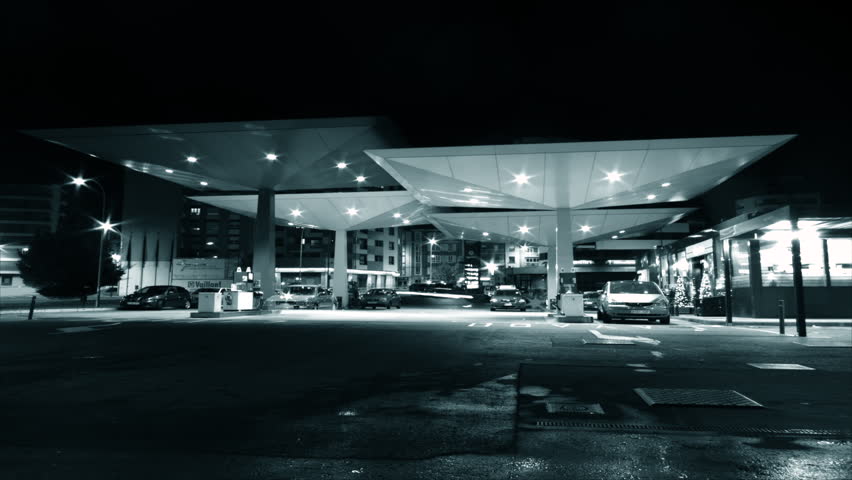 SPAIN - CIRCA 2012: Time lapse of several cars filling fuel at gas station at