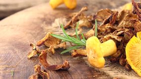 Dried Chanterelles on a rotating wooden plate (seamless loopable; 4K)