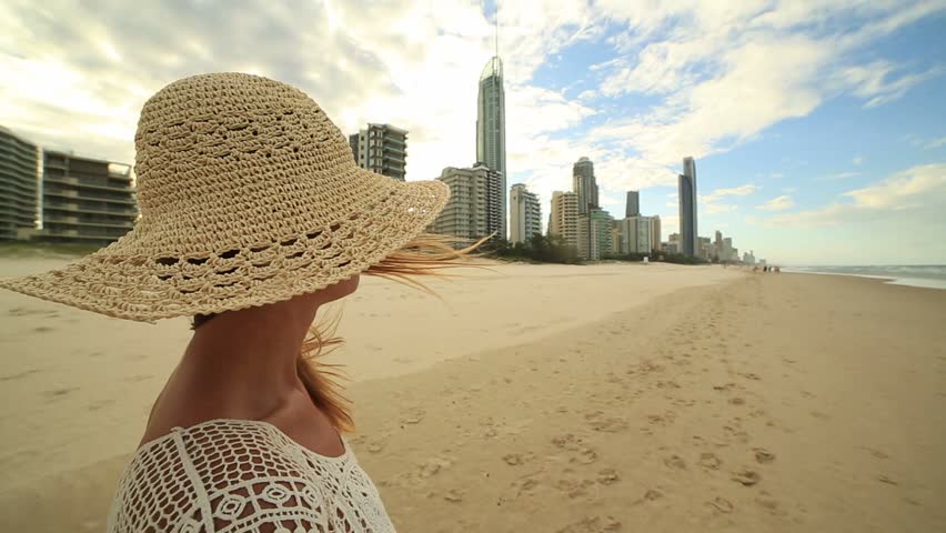 Caucasian female in Surfers Paradise Australia makes heart shape finger frame
