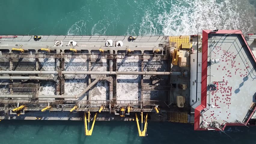 Suction Dredger ship working near the port - with mud, Pollution, brown Muddy water - aerial shot Royalty-Free Stock Footage #30577999