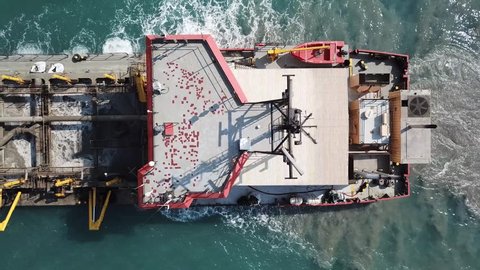  Suction Dredger ship working near the port - with mud, Pollution, brown Muddy water - aerial shot