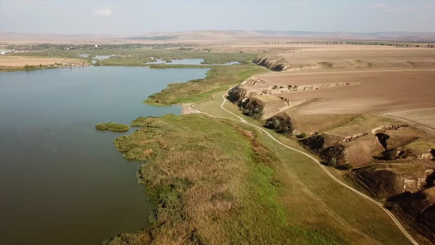 Traian lake nature reserve located in northern Dobrogea - Romania (aerial with slopes and ravines carved into the loess)