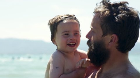 Dad Tells His Little Boy A Joke, He Laughs And Gives His Dad A Big Hug, Cute Candid Moment, Slow Motion