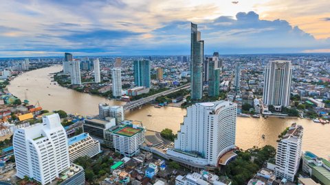Aerial Bangkok Citysacpe And Chao Phraya River Of Bangkok, Thailand 4K Time Lapse (zoom out)