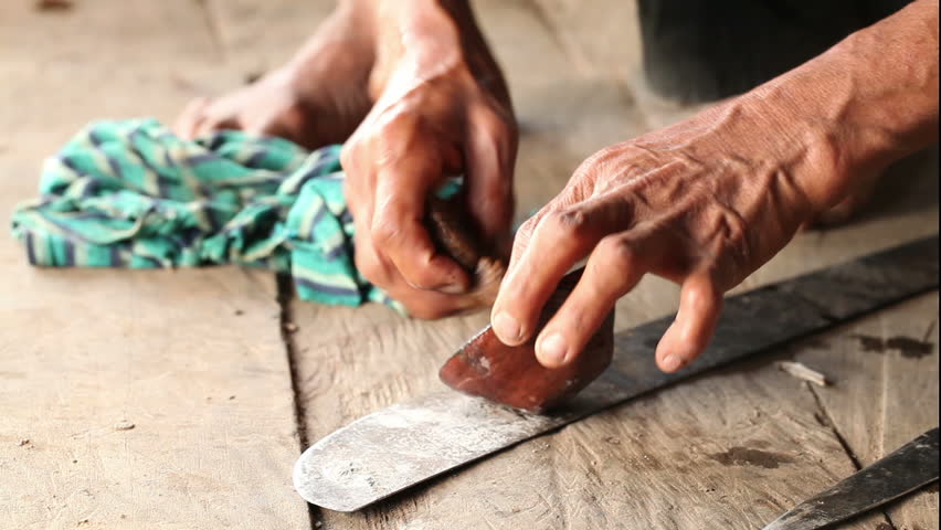Adult woman making pottery , rural scene in ecuadorian Amazonia, finishing