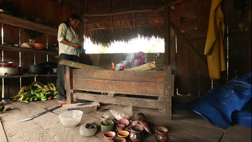Adult woman making pottery , rural scene in ecuadorian Amazonia