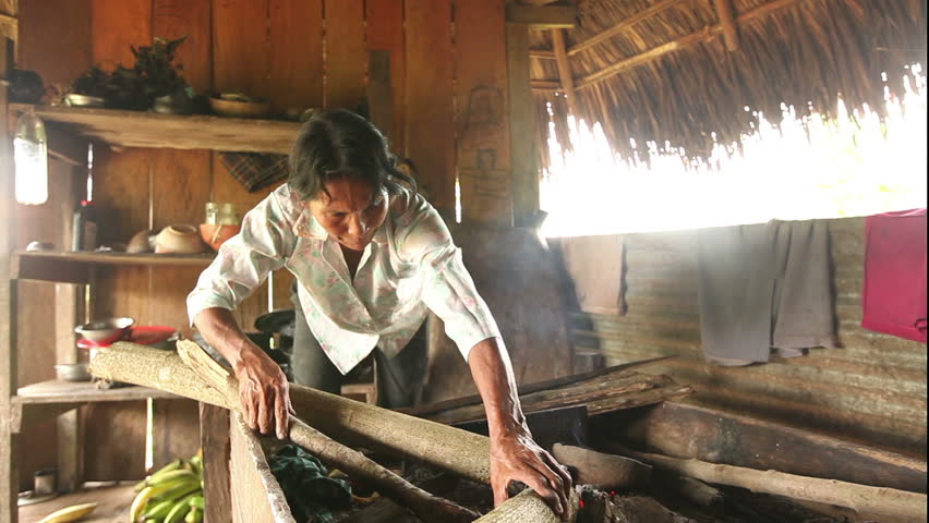 Adult woman making pottery , rural scene in ecuadorian Amazonia. When the