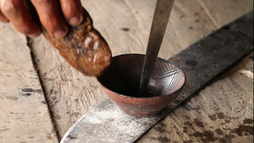 Adult woman making pottery , rural scene in ecuadorian Amazonia the pot is