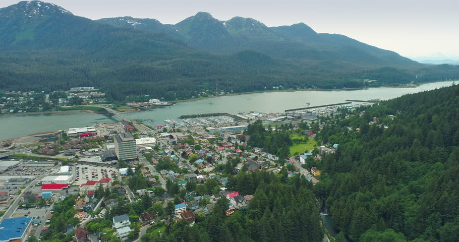 AERIAL: cityscape of the town of Juneau, Alaska, USA