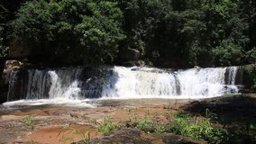 Waterfalls, sky and green trees. Chaiyaphum.