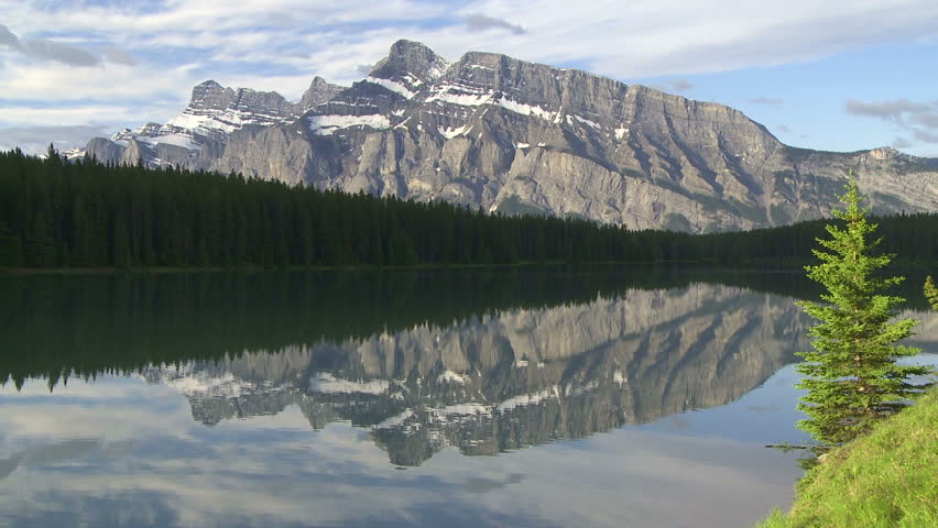 Mountain reflection in alpine lake. Mount Rundle and Two Jack Lake at Banff,