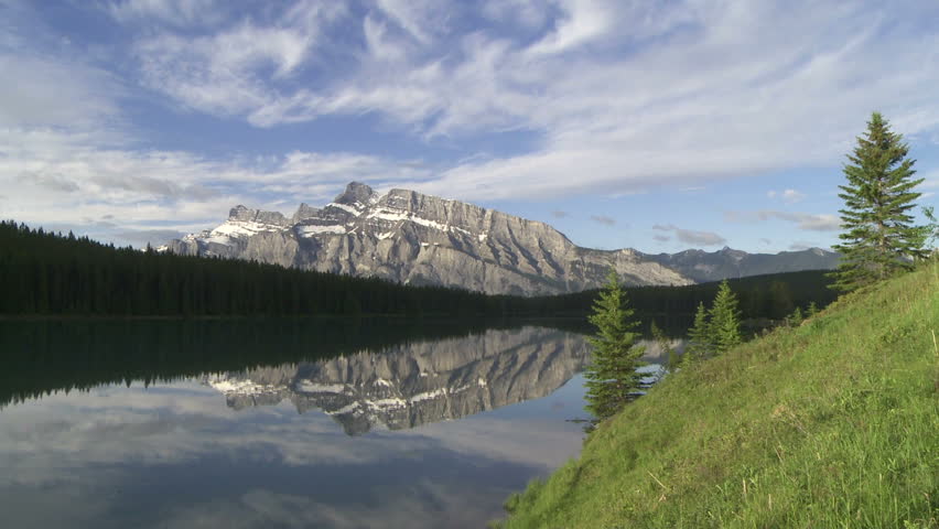 Mountain reflection in alpine lake. Mount Rundle and Two Jack Lake at Banff,