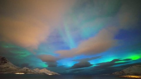 Time-lapse of Aurora Borealis over the fjord